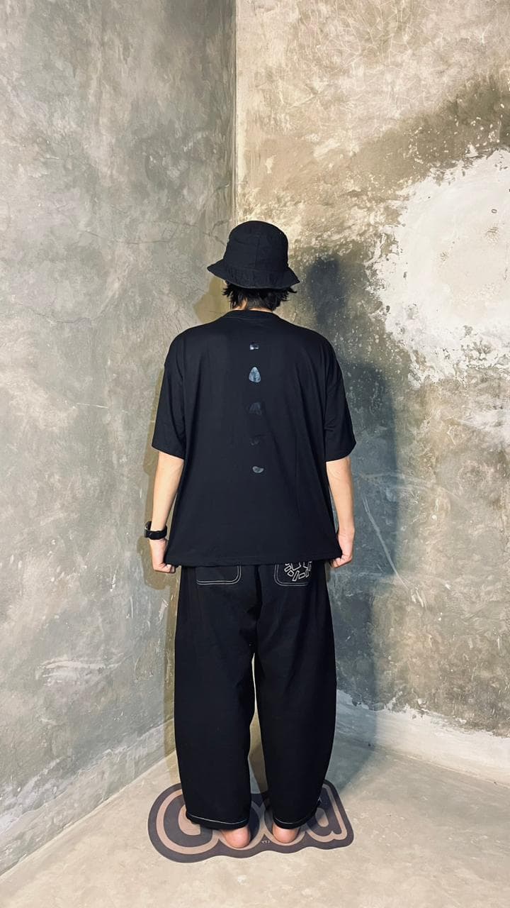 Ascent Tee — studio back view